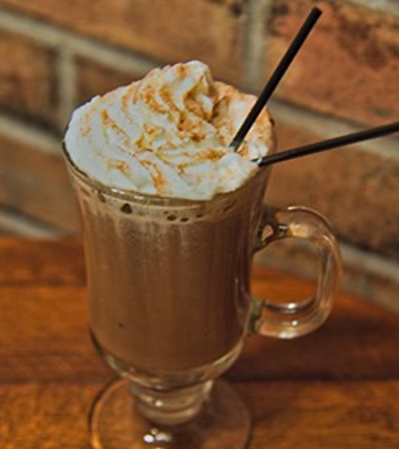 Hot cocoa topped with whipped cream and cinnamon at Patrick’s Pub & Eatery