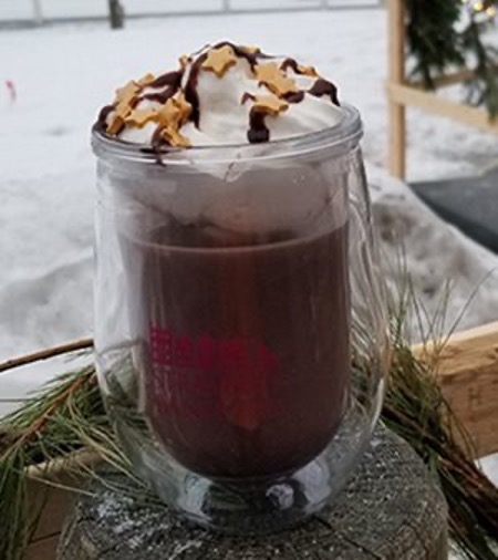 Hot cocoa topped with whipped cream, chocolate drizzle and sprinkles at Strawberry Banke, Portsmouth