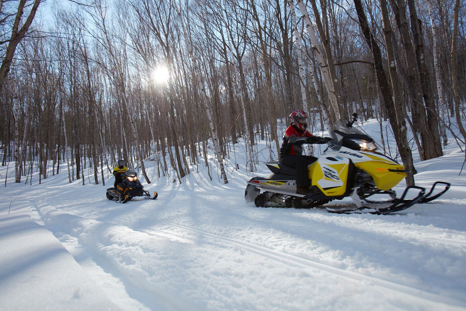 2 people snowmobiling