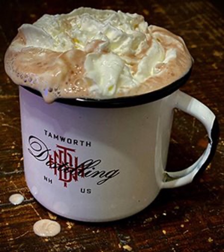 Cup of hot cocoa topped with whipped cream at AC Lounge at AC Hotel Portsmouth